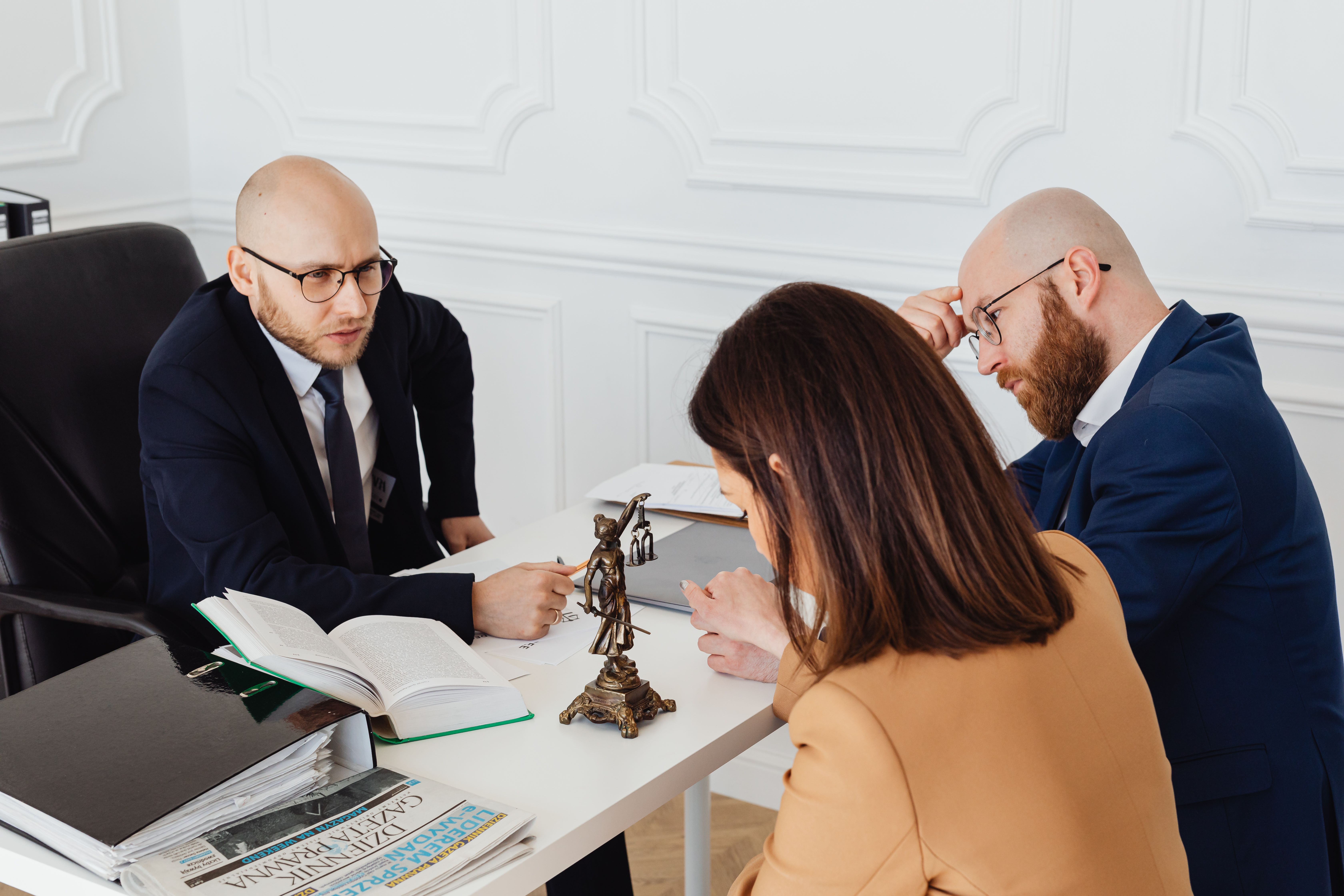 Lawyer consulting clients during a serious legal discussion